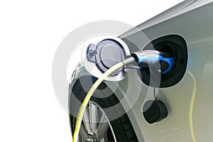 Closeup of electric hybrid car being charged with socket