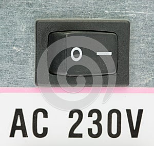 Closeup of the electrical switch on the back of the computer power supply