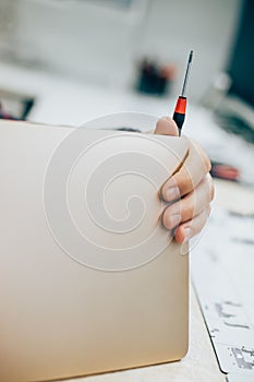 Electrician engineer technician repair faulty laptop computer in electr service photo