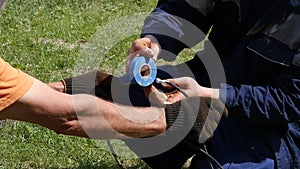 Closeup of electrician hands, tools and wires. insulation of electrical wire. slow motion