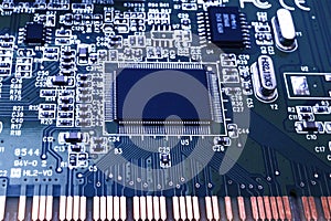 Closeup of an electronic circuit board with a processor.