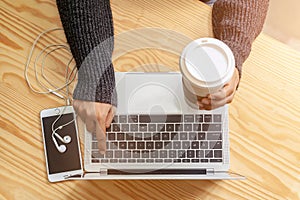 closeup elegant beautiful female hands type on keyboard mouse of a laptop computer,in cafe , successful business woman,working