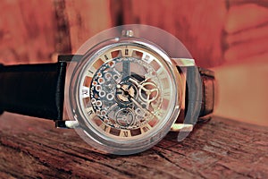 Closeup of elegant men watch with a visible mechanism