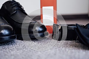 Closeup of elegant stylish brown male accessories isolated on white gray background. Preparation for wedding concept