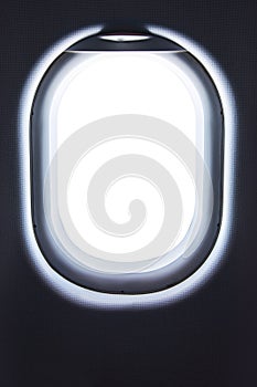 Closeup of empty aircraft`s porthole. Airplane window photo