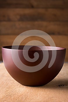 Closeup empty brown bowl, background