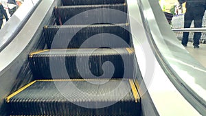 Closeup of an empty escalator moving up in an mall