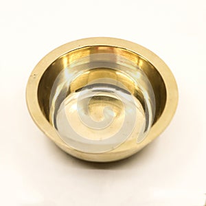 closeup of empty gold bowl plate used in the kitchen