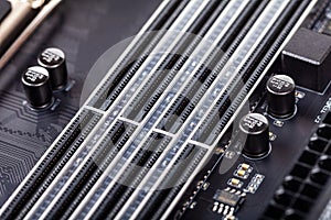 Closeup on empty RAM slots on a modern black silver motherboard. Ddr4, ddr5 random access memory stick slots, ram placing order