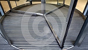 Closeup of entrance in modern business center with revolving rotating doors