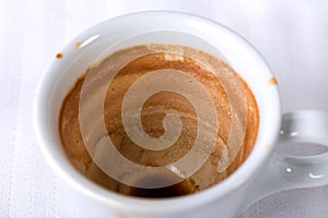 Closeup of espresso cup after coffee. photo