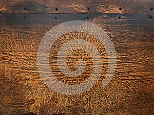 Closeup of etched copper burst pattern texture on garage doo