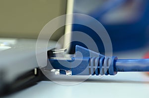 Closeup ethernet cable connected to the Lan port on laptop for c