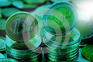 Closeup of eurocoins stand on a pile of coins.