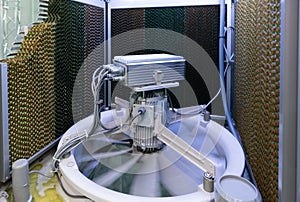 Closeup : Evaporator and electric motor fan, controler box inside a Evaporative Cooler - Active Cooling System