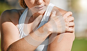 Closeup, exercise and woman with shoulder pain, outdoor and inflammation after training, workout and tension. Female