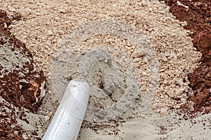 Closeup Of Exiting Pipe From Sand And Marl Packing