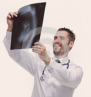 Closeup of an experienced physician examining x-ray