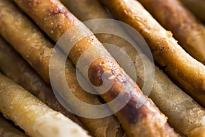 Closeup of a extra long sticks of Fried Lumpia or Filipino Spring Rolls