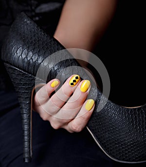 Closeup of a extravagant yellow nails