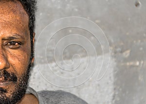 Closeup of face of an aged worried homeless black man