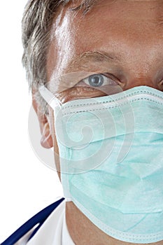 Closeup of face of elderly doctor with mask