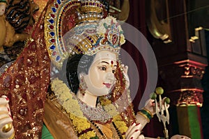 Closeup face photo of indian hindu goddess maa durga shakti idol in sacred temple on the occasion of navratri