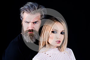 Closeup face portrait of sensual couple. Hipsters love. Rock style. Fashion studio photo of beautiful sensual couple