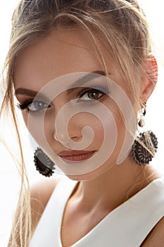 Closeup face of a pretty caucasian model looking at camera