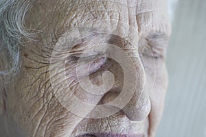Closeup face of a senior person crying