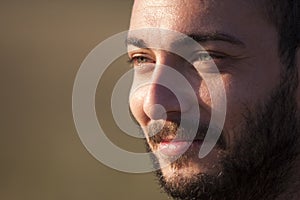 Closeup face. Smiling man with beard