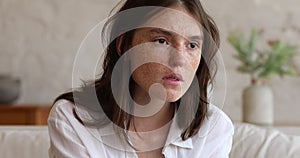 Closeup face stressed sad young woman suffering of psychological trauma