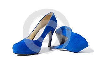 Closeup of fashionable high heels shoes isolated on white background. Blue color woman shoe on floor. Shopping and fashion concept