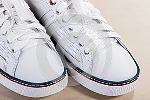 Closeup of Fashionable Modern Laced Sneakers in Whit