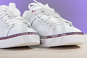 Closeup of Fashionable Modern Laced Sneakers in White.