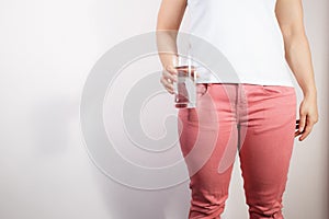 Closeup fat woman holding drinking water glass in her hand