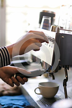 Closeup, Female barista making coffee