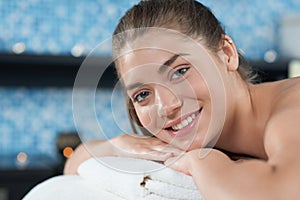 Closeup of female client in spa during relaxing back massage