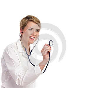 Closeup of female doctor holding stethoscope.