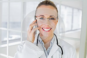Closeup of a female doctor using mobile phone