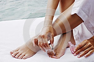 Closeup of female feet and hands