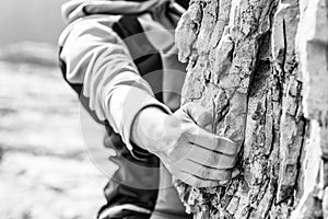 Closeup of female hand rock climbing.