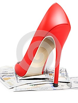 Closeup of female red highheel stepping on pile of money