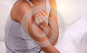 Closeup female`s arm. Arm pain and injury. warm light tone