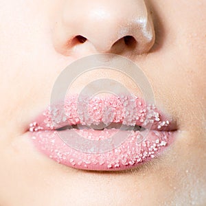 Closeup on female sweet candy sugar lips kiss