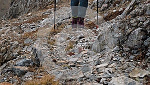 Closeup of Female Traveler Crossing Rocky Terrain