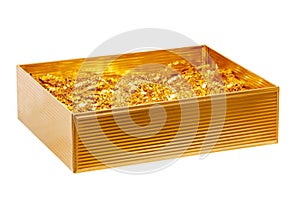 Closeup of a festive rectangular golden metallic gift box isolated on a white background. Macro photograph with space for your