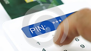 Closeup finger entering incorrect or wrong pin personal identification number for electronic purchasing by credit or debit card