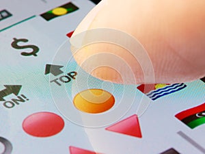 Closeup finger taping icon on screen keyboard