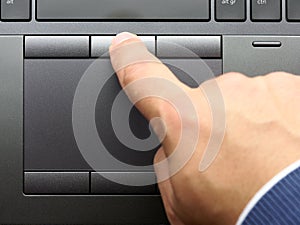 Closeup finger typing laptop keyboard